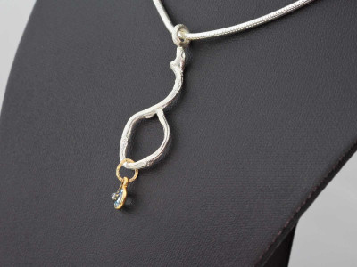 Necklace with Twig cast in Silver with 9ct Gold pendant holding a faceted Aquamarine (sold out)